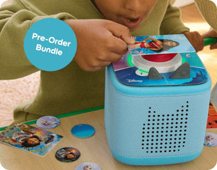 Child playing with a Disney educational game on a Toniebox
