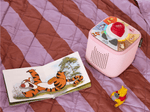 child playing with pink Toniebox 2, tonieplay controller, Winnie the Pooh tonie and disney tonieplay game